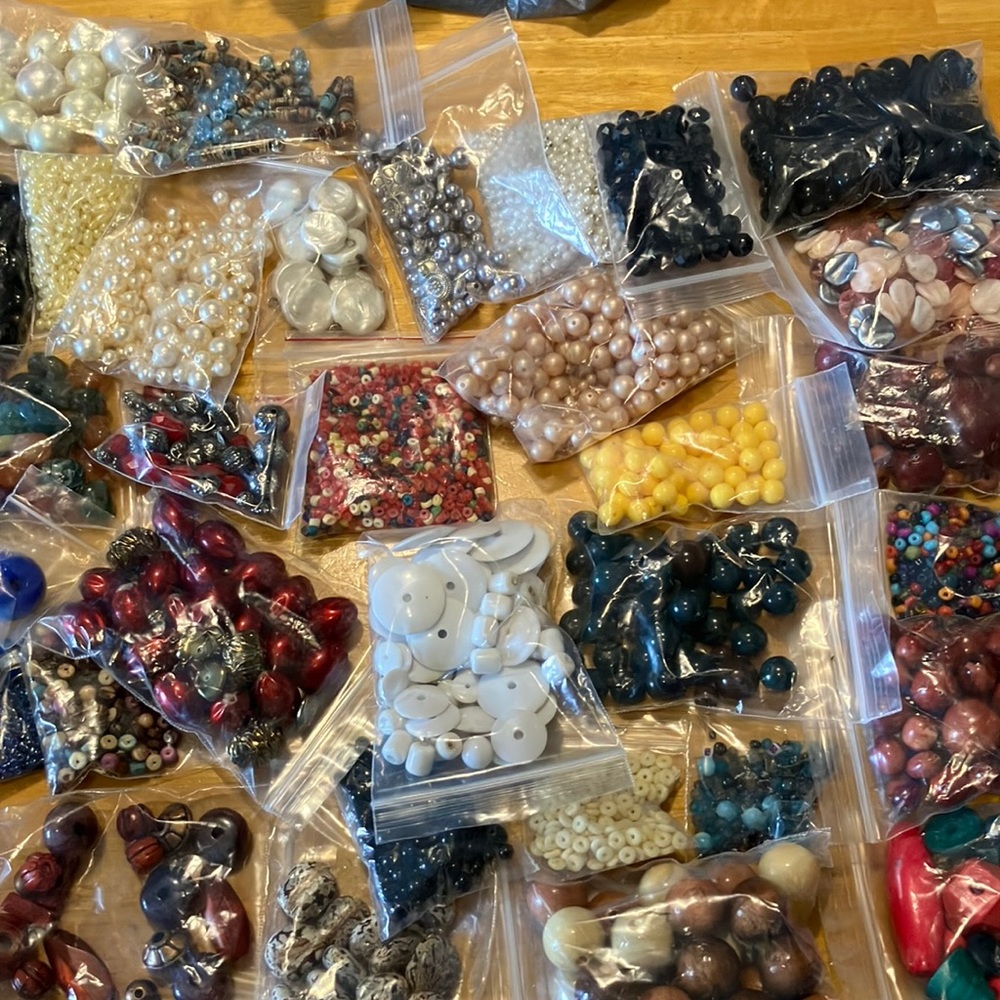 Over 5 pounds of assorted beads, crafting supplies